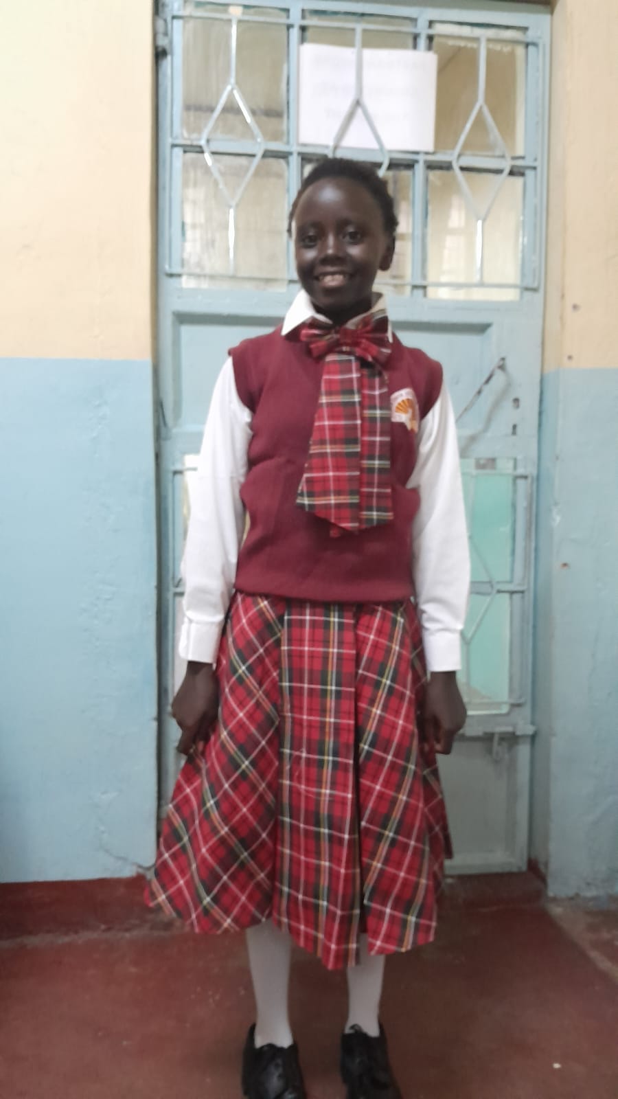 A child in her school uniform