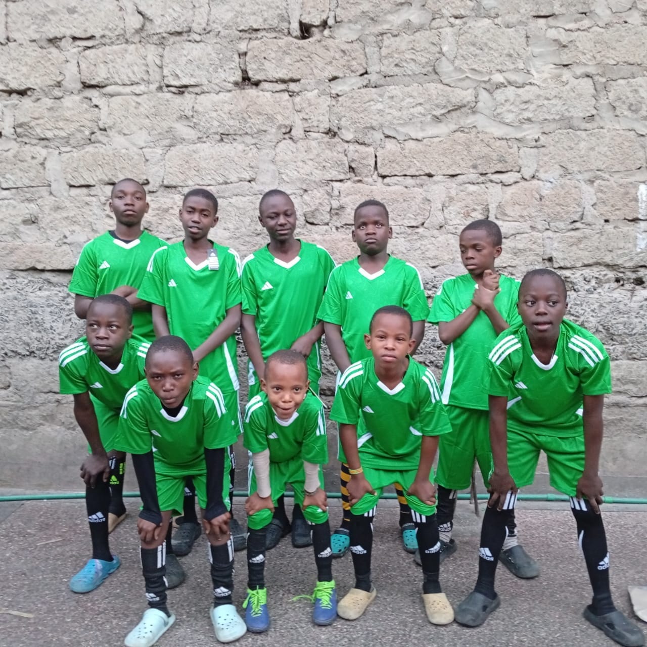 A football team in matching green kits